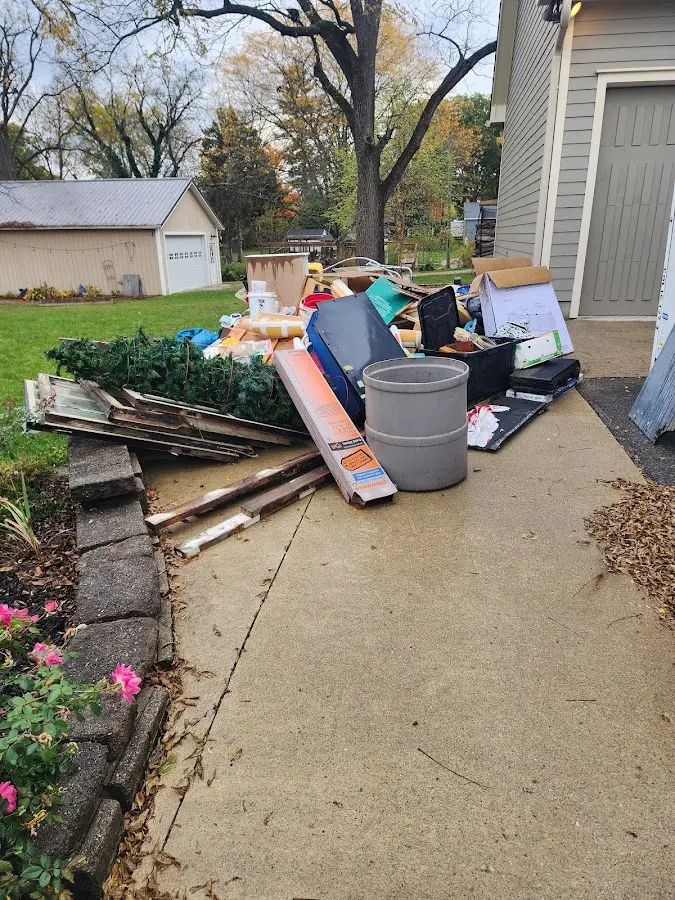 Dumpster being loaded with debris for Commercial Dumpster Rental in Chattanooga Valley